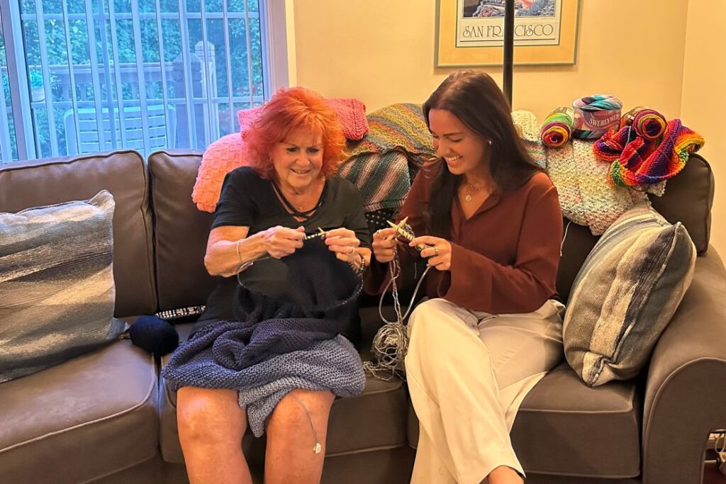 Lea Horowitz knits with granddaughter Riane Lumer.